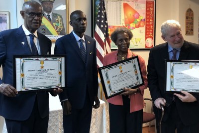 Melvin Foote, Alassane Diallo (Chargé d'Affairs), Vivian Lowery Derryck and Chic Dambach (left-to-right) after a ceremony at the three Americans were honored as Knights of the National Order during a ceremony at the Mali Embassy in Washington, DC.