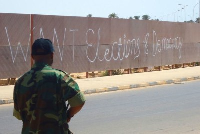 Graffiti on a wall in Benghazi, Libya, calls for elections and democracy (file photo).
