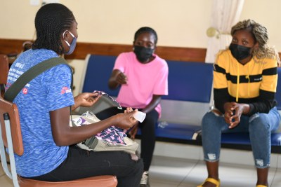 Peer educator having a group discussion with young women.