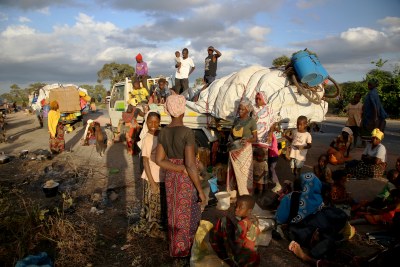 People displaced by the conflict in Cabo Delgado, a northern province in Mozambique, wait next to a truck on the outskirts of Mueda (file photo).